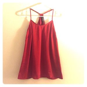 Red silky racetrack tank.