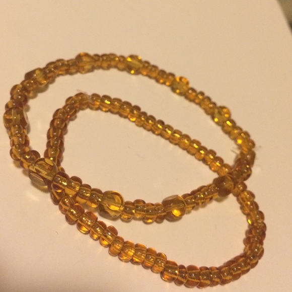 Clear gold colored glass bead bracelets (2)