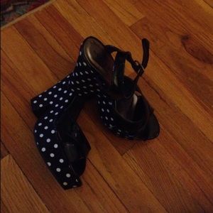 Black polka dot wedges.