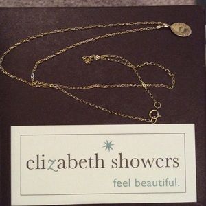 This necklace is gold & in the original gift box.