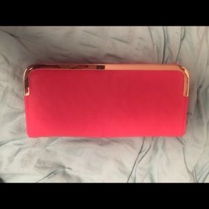 Coral wallet, never used.