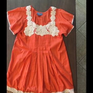 Orange top with cream lace/detail