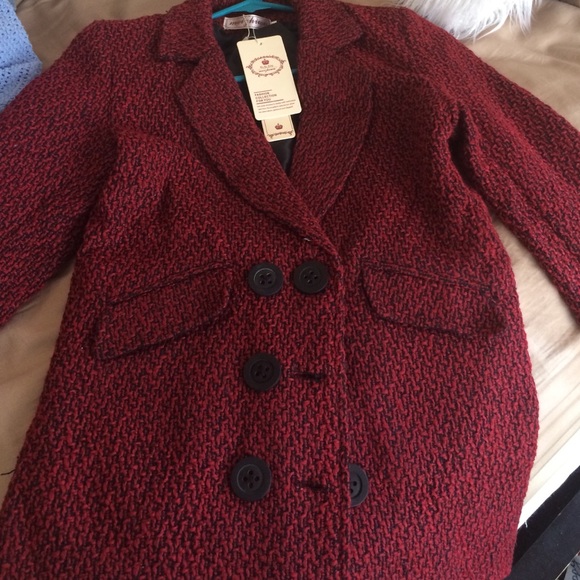 À small red/black peacoat.