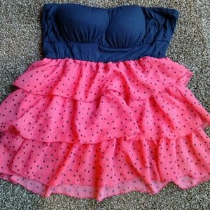 Strapless top with ruffles.