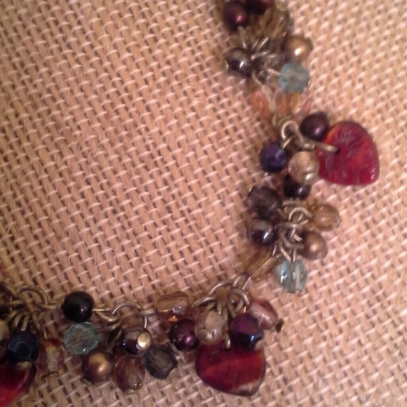 Beaded necklace with decorative hearts