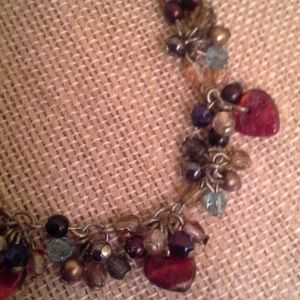 Beaded necklace with decorative hearts