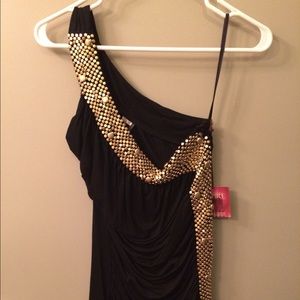 Black one shoulder top with gold embellishment