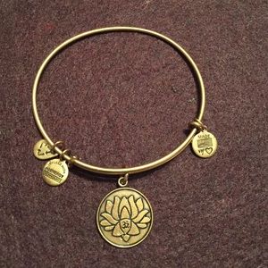 Gold Alex & Ani lotus/ Om bangle