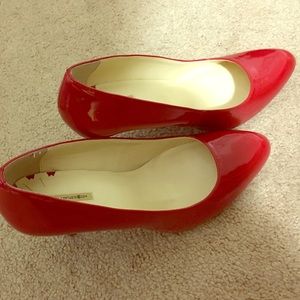 8.5 red patent pumps
