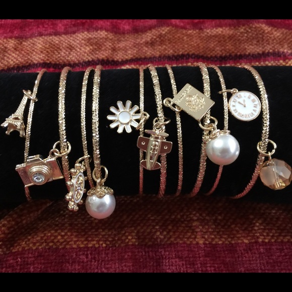 Set of bangle bracelets with charms in silver