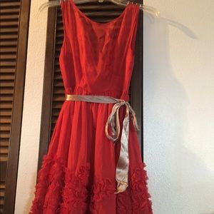 Anthropologie red dress with lace details.