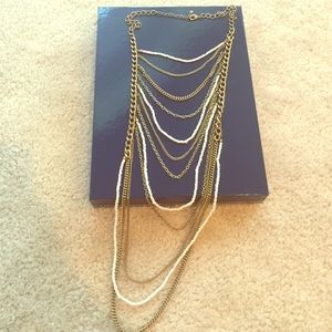 Gold and white multiple chain necklace