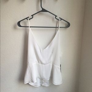 White Vneck Peplum Shirt With Low Back