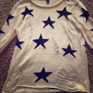Star sweater with rips