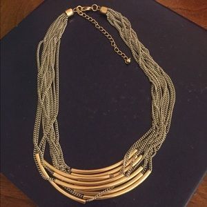Gold toned multi stranded necklace.