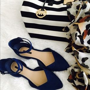 Blue flats with double buckle.