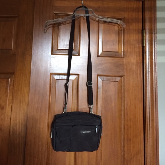 Baggallini purse. Brown.  Zippered compartments.