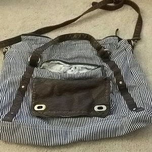 Striped bag. Floral lining. Faux leather detail