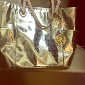 Michael Kors Gold shoulder bag.