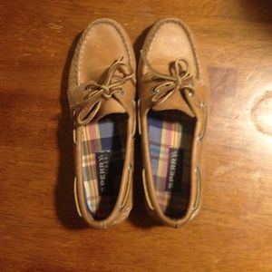 Women's Sperry Too-Sider brown leather boat shoes.