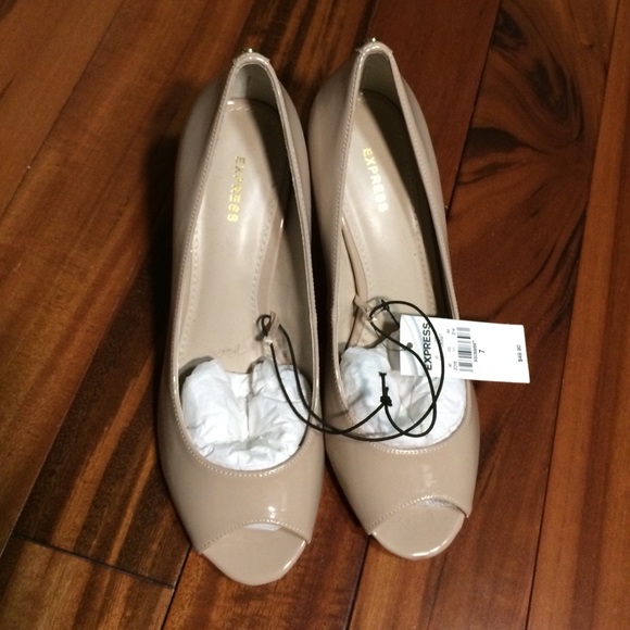 Very cute brand new open toe nude pumps.