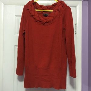 Orange sweater with braided neckline