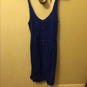 Blue dress with golden buttons.