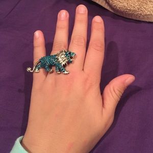 Ring with a tiger attached