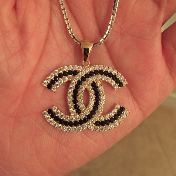 Channel charm 18 k gold. Only selling the charm.