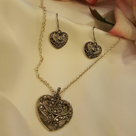 A beautiful silver heart and earings  set as new