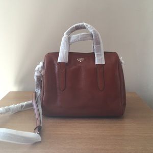 Dark brown fossil bag with cross body strap.