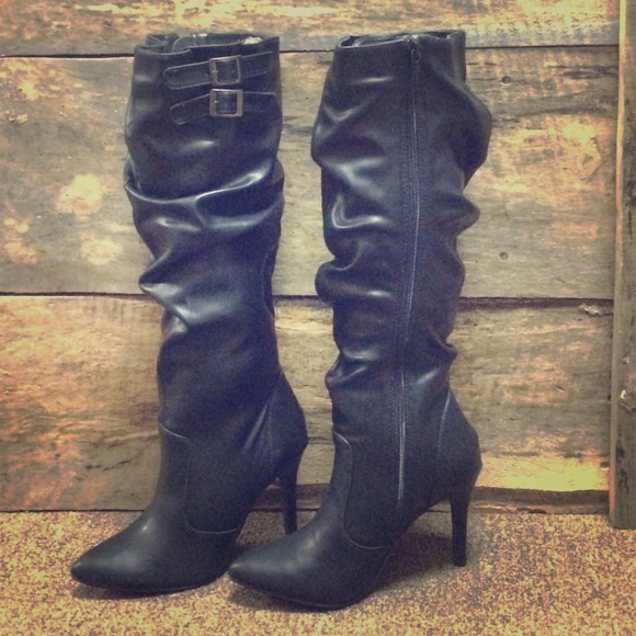 Black high heel boots with buckle detail