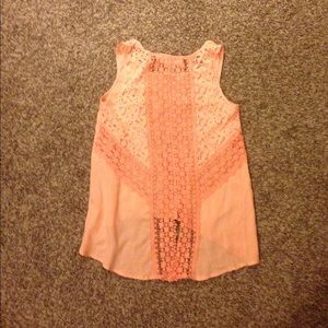 Peach colored high-low crop top