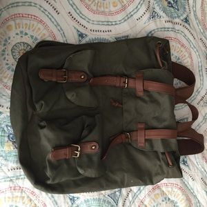 Army green and leather back pack