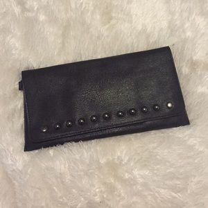 Brown leather clutch