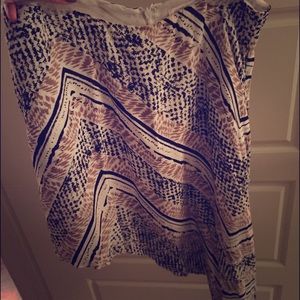 Asymmetrical skirt. Neutral colors