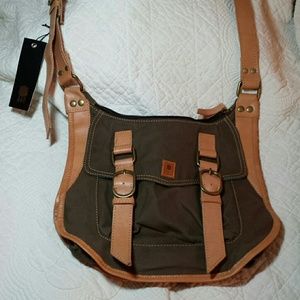 Cross body saddle bag styled handbag.