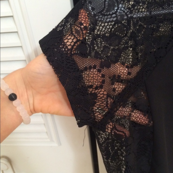 Black top with lace shoulders and sides. - Picture 2 of 3