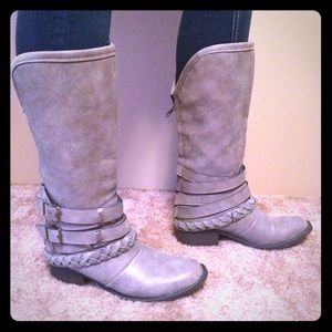 Grey boots with straps and buckles