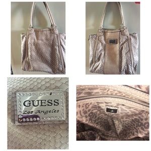 A super cute and stylish Authentic Guess purse!