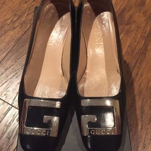 Gucci black heels with silver G buckle