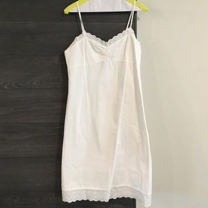 White seersucker dress. Above the knee.