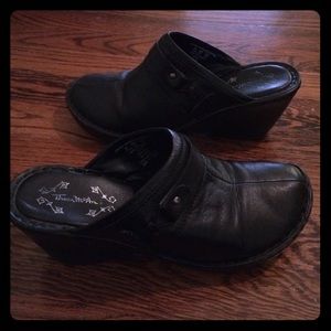 Black wedge clogs