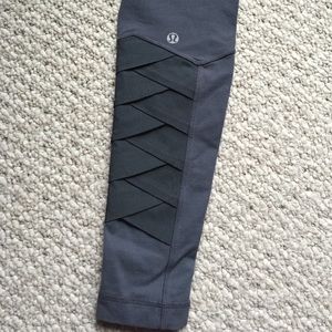 Lululemon dark gray pants with detailed ankle.
