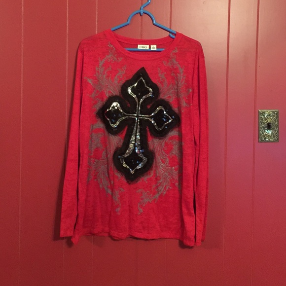 Red long sleeve shirt with a beautiful cross.