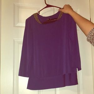 Purple blouse with beading around the neck