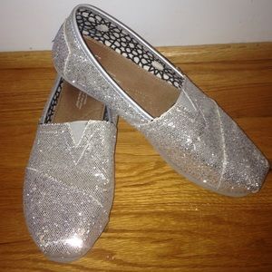 Silver sparkly TOMS.