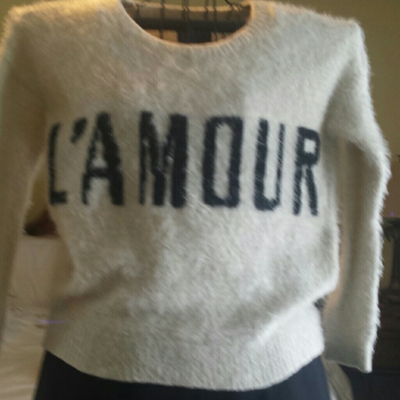 Sweater looks like mohair. Very warm acrylic poly