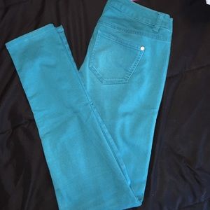 Blue/Green skinny jeans.