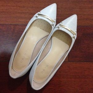 White pointy flats with gold decor